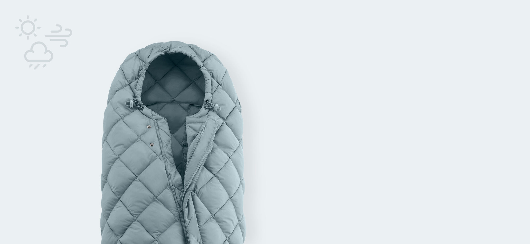 Snogga footmuff in light blue with quilted design on a light background.