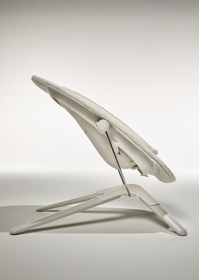 Side view of the Lemo Platinum baby bouncer, highlighting its sleek design and sturdy base.