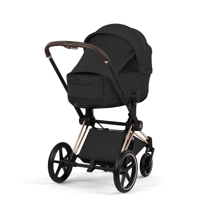 An image of the CYBEX Platinum Priam Fold Lux Carry Cot - Style Collection Stroller, highlighting the Extended Sun Canopy with Integrated Sun Sail and Visor feature.