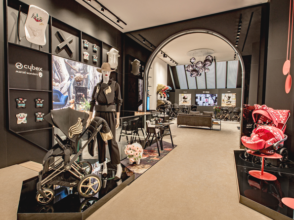 CYBEX Flagship Store Amsterdam featuring modern prams and stylish interior design.