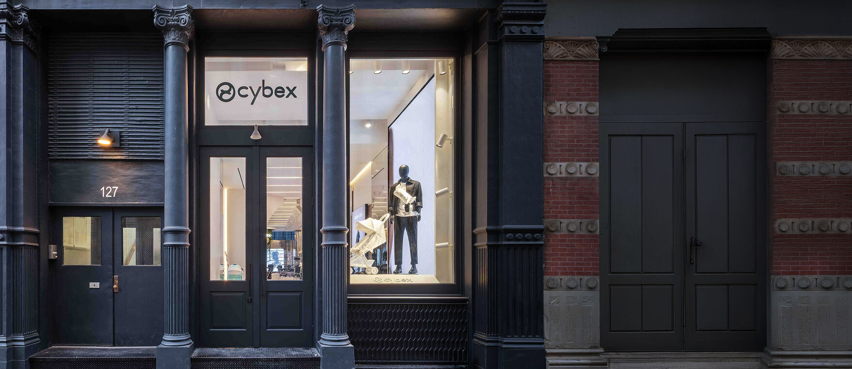 CYBEX Flagship Store New York with a mannequin and a Coya Urban Mobility lightweight stroller in the window.