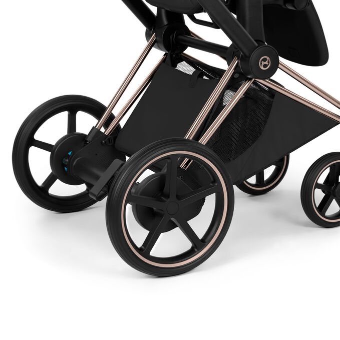An image of the CYBEX Platinum e-Priam - Style Collection Stroller, highlighting the Extra-large color matching basket feature.