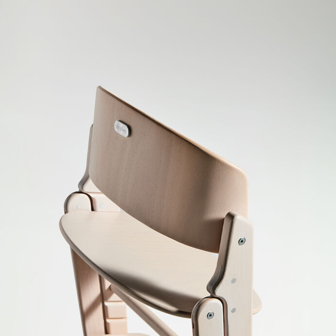 Click and Fold high chair in light wood with elegant design.