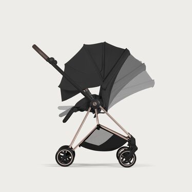An image of the CYBEX Platinum Mios Seat Pack - Style Collection Stroller, highlighting the Ergonomic Near-Flat with XXL extendable Canopy feature.