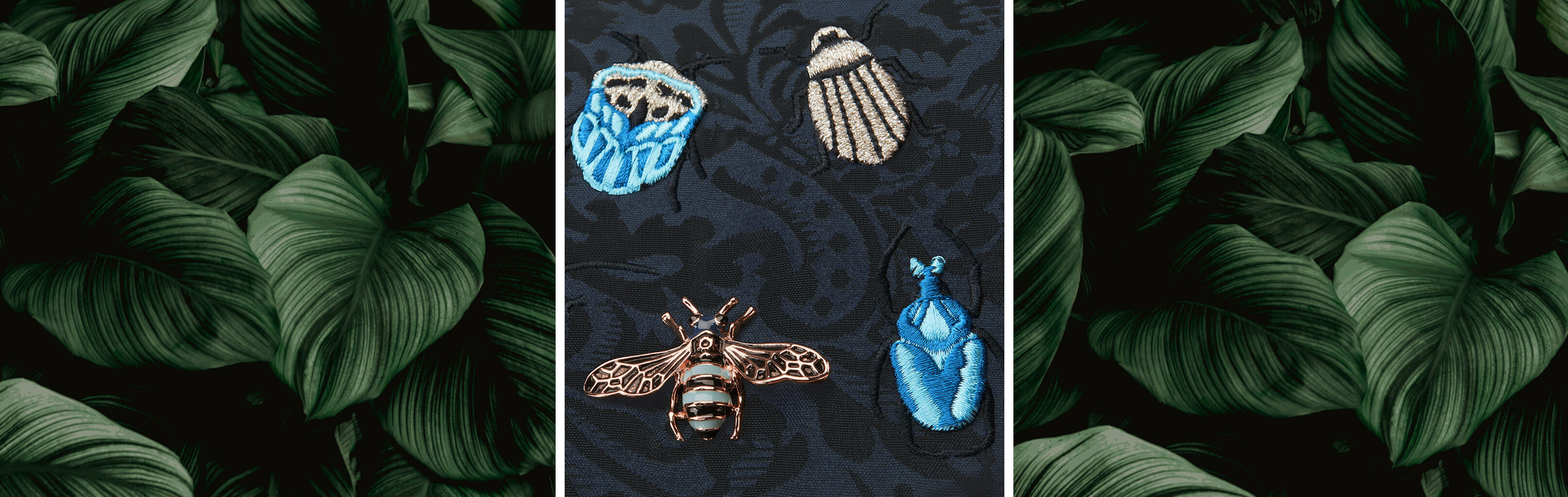 Embroidery of four insects on dark fabric, surrounded by green leaves.