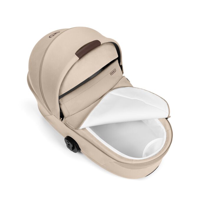 An image of the CYBEX Gold Balios Fold Cot Stroller, highlighting the Inner Cot Pocket feature.