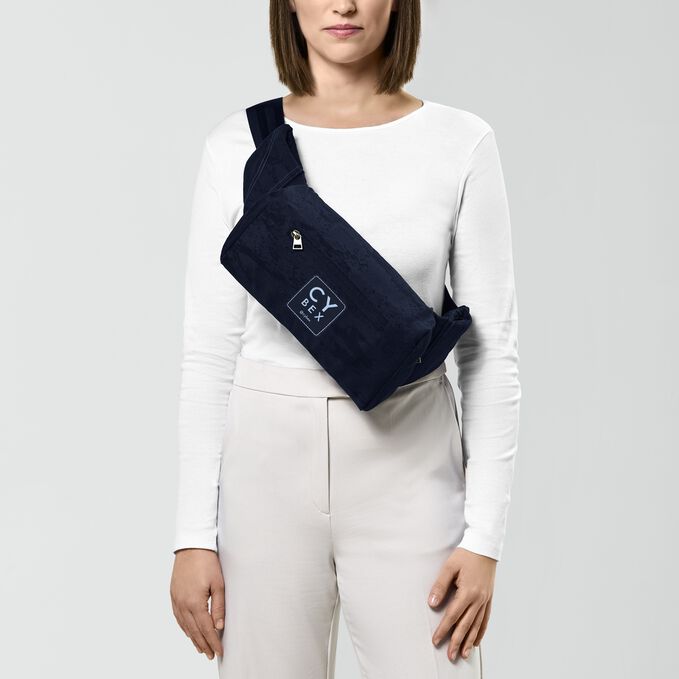 An image of the CYBEX Platinum Coya Carrier Rebellious Luxury Baby Carrier, highlighting the Trendy Crossbody Bag feature.
