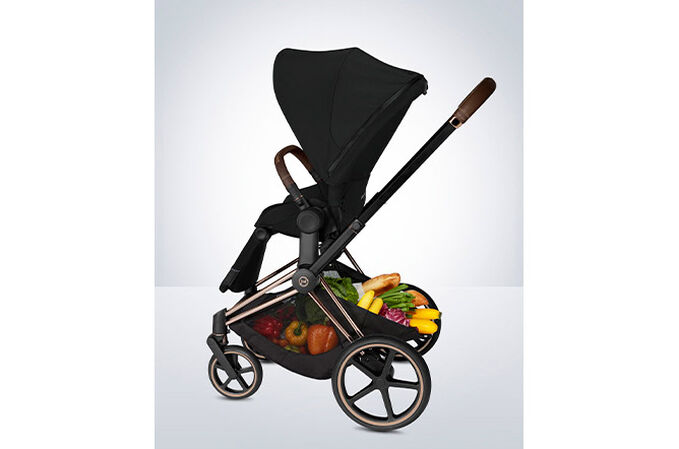An image of the CYBEX Platinum Priam 3 Frame Stroller, highlighting the Extra-large shopping basket feature.