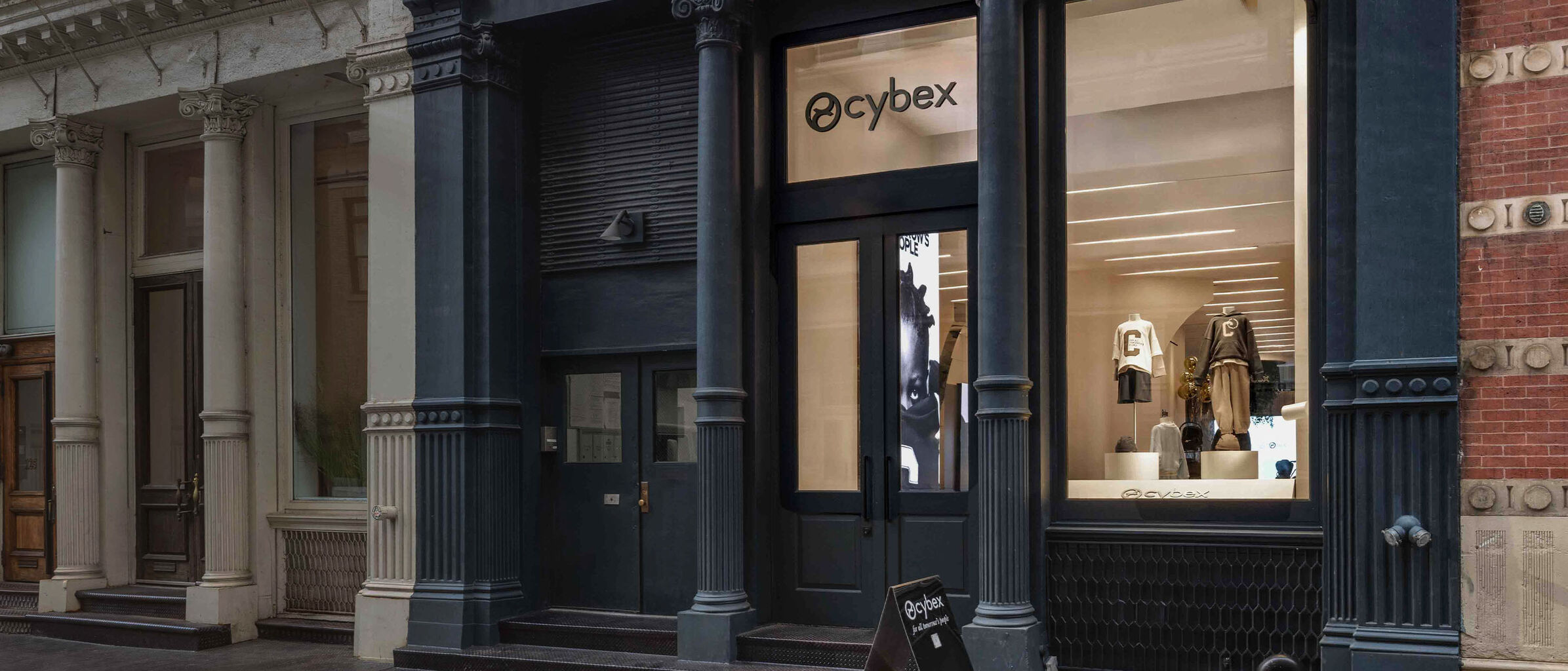 CYBEX Flagship Store New York with a mannequin and a Coya Urban Mobility lightweight stroller in the window.
