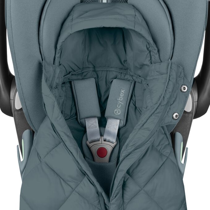 An image of the CYBEX Gold Snogga Mini 2 Accessories for Car Seats, highlighting the Fits All Harness Systems feature.