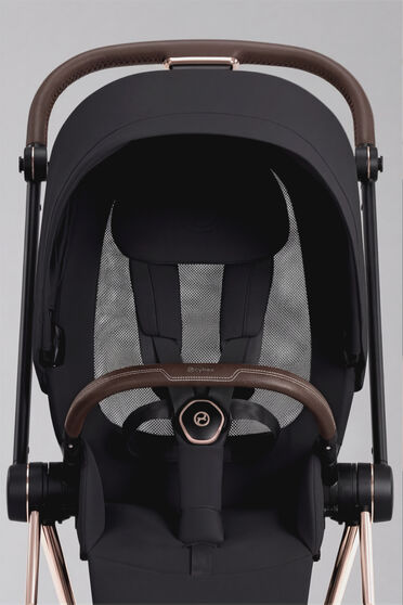 Product image of a Mios stroller and the breathable backrest.