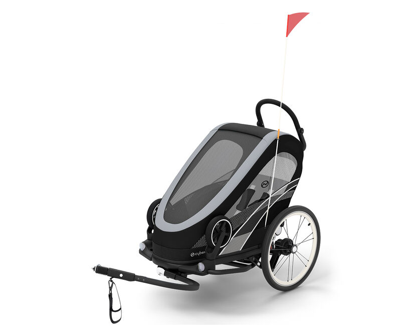 Zeno Bike trailer, a sleek black and grey bike trailer for kids with a red flag.