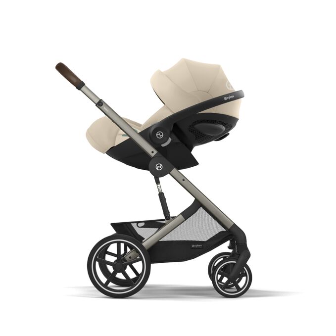 An image of the CYBEX Gold Cloud G i-Size Infant Car Seat, highlighting the Easy transition from car to pushchair feature.