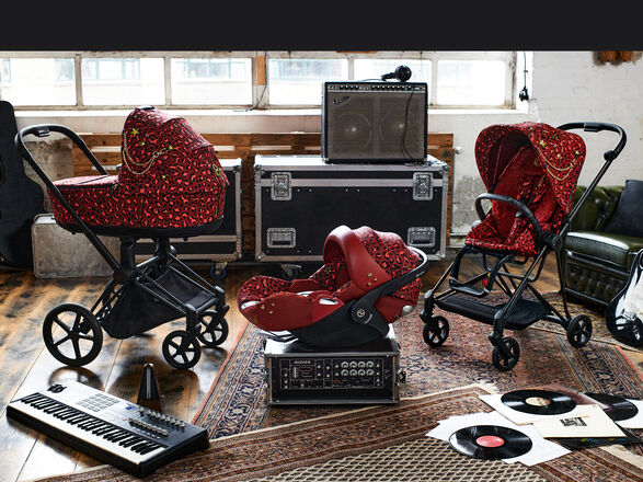 CYBEX Rockstar pram and baby car seat in a music studio with instruments and vinyl records.