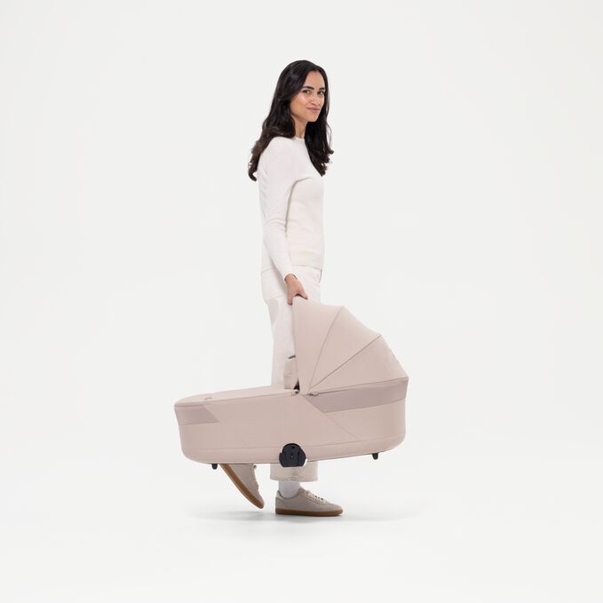 An image of the CYBEX Gold Balios S Lux with Balios Cot S Lux Stroller, highlighting the Canopy Carry Handle feature.