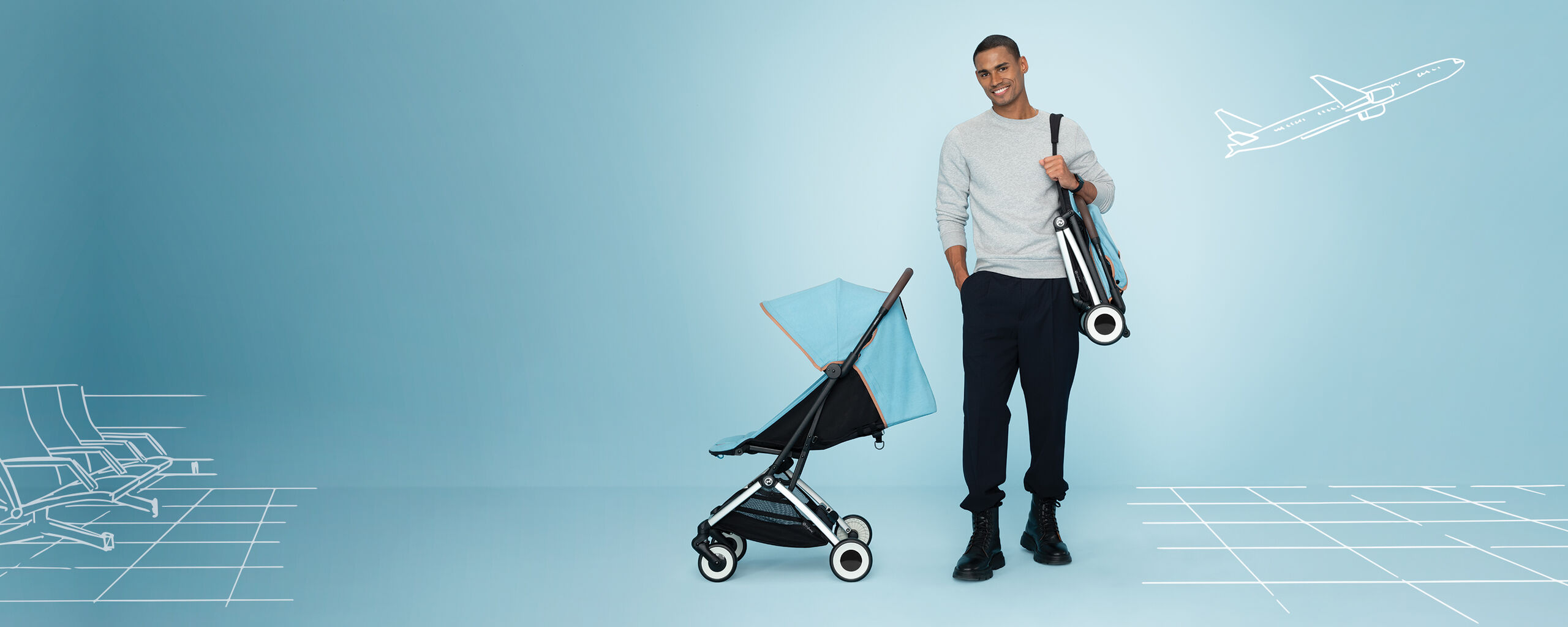 Orfeo compact travel stroller with blue canopy next to a man carrying the folded stroller.