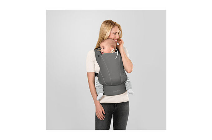 An image of the CYBEX Gold MAIRA.click Baby Carrier, highlighting the Multifunctional headrest feature.