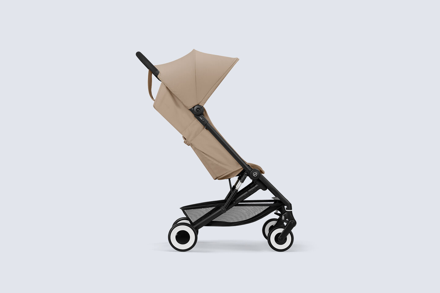 Side view of the Agis travel stroller in Almond Beige
