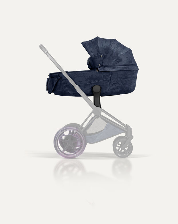 Product shot of a Rebellious Luxury e-Priam with Fold Cot.