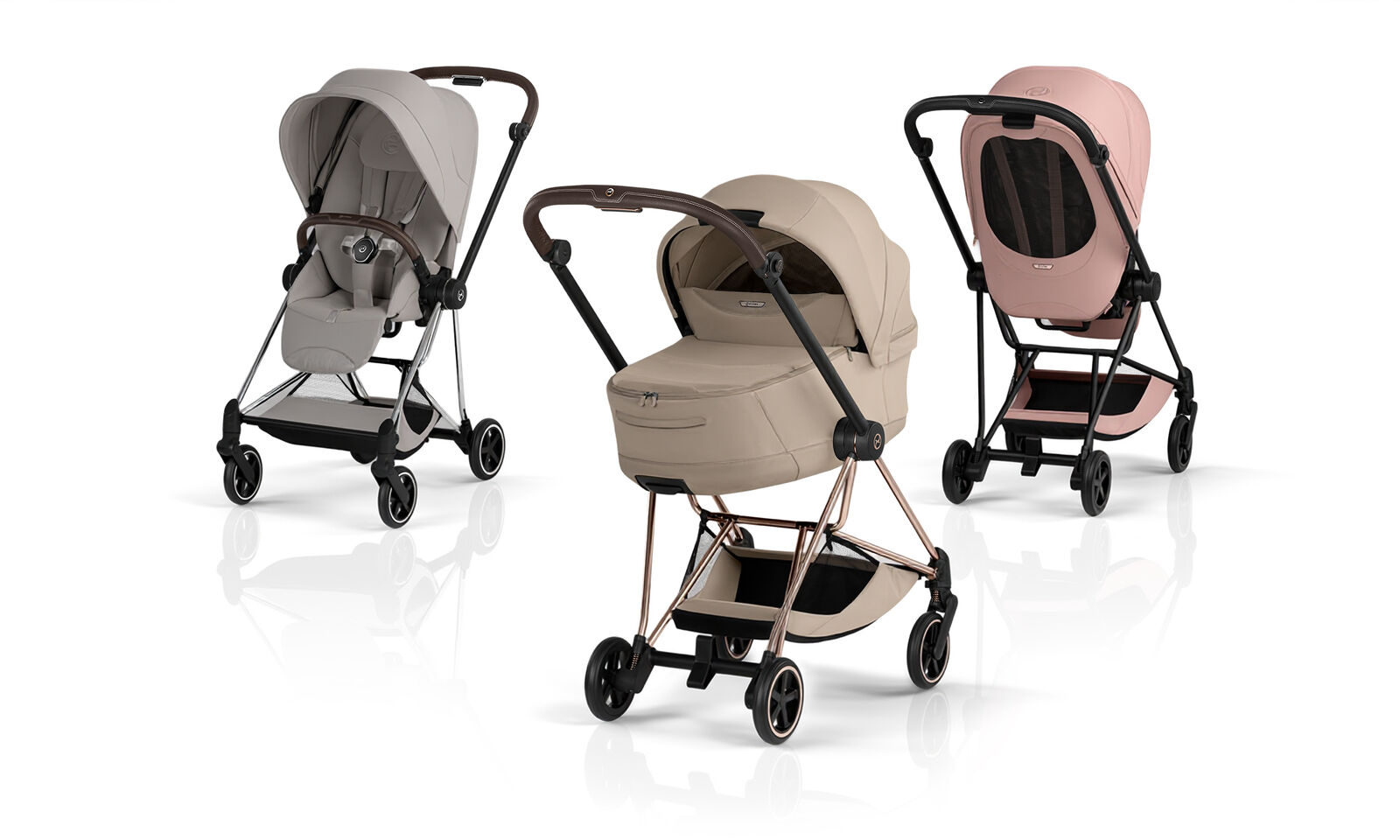 Three Mios Style strollers in different colors and with different attachments.