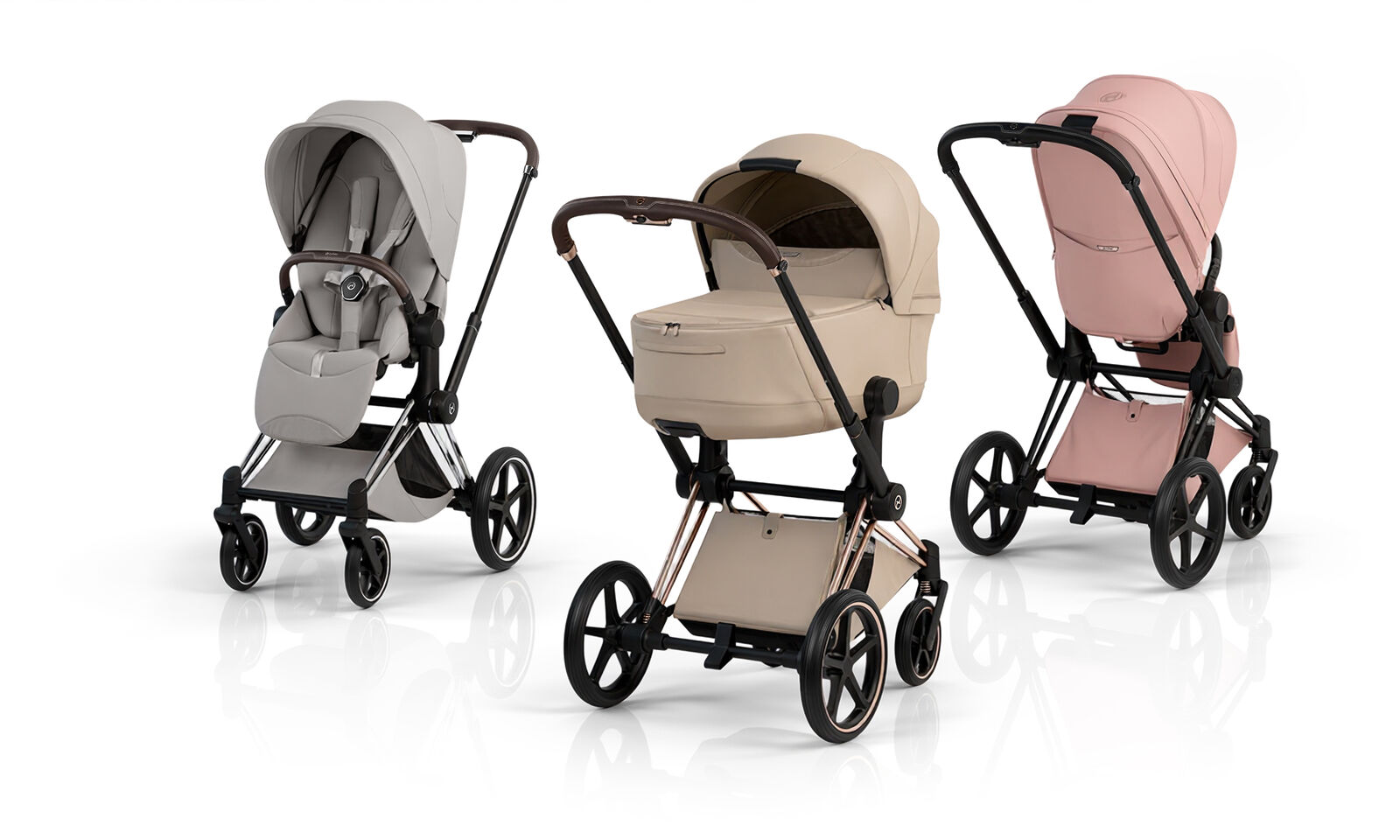 Three Priam Style strollers next to each other in different colors and with different attachments.