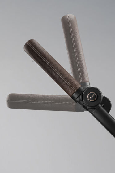 Close up of the adjustable handlebar and its different height positions.