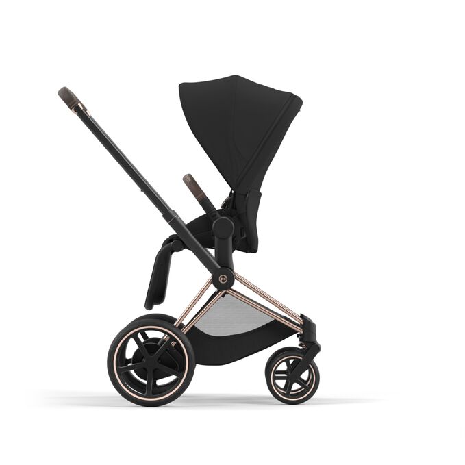 An image of the CYBEX Platinum e-Priam Jeremy Scott - Car Stroller, highlighting the Reversible Seat Unit feature.
