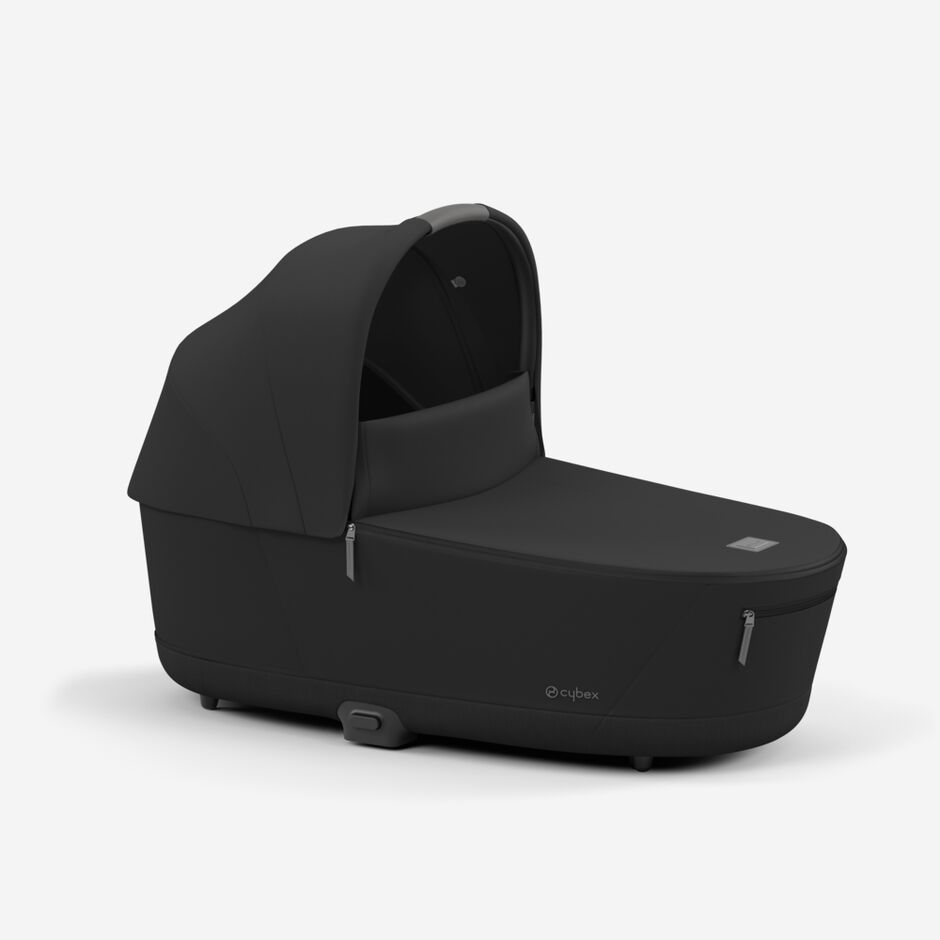 An image of the CYBEX Platinum Priam / e-Priam Seat Pack (2025) Stroller, highlighting the Comfortable Lux Carry Cot feature.