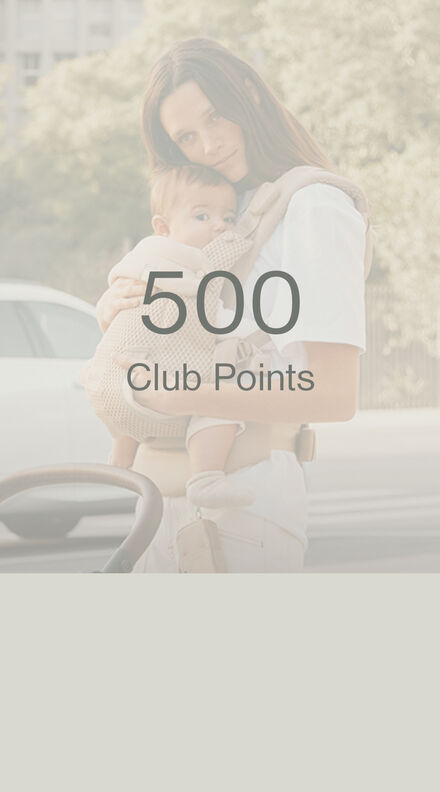 A mother cradling her child in a CYBEX baby carrier. It reads "500 Club Points". 