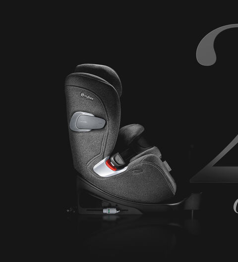A grey Cybex car seat against a black background, with the word "NEW" at the bottom.