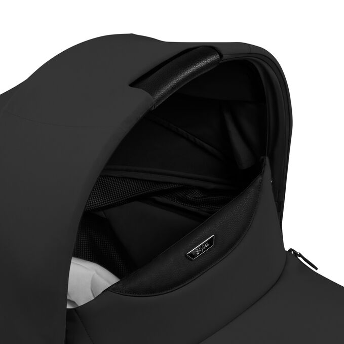 An image of the CYBEX Platinum Priam Fold Lux Carry Cot Stroller, highlighting the Canopy Carry Handle feature.