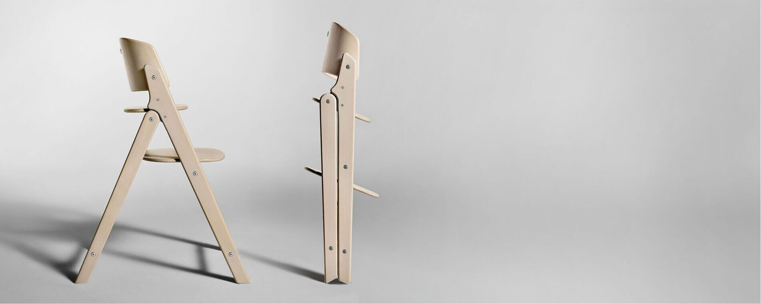 Two Click & Fold Chairs, on the left standing normally, on the right, folded up.