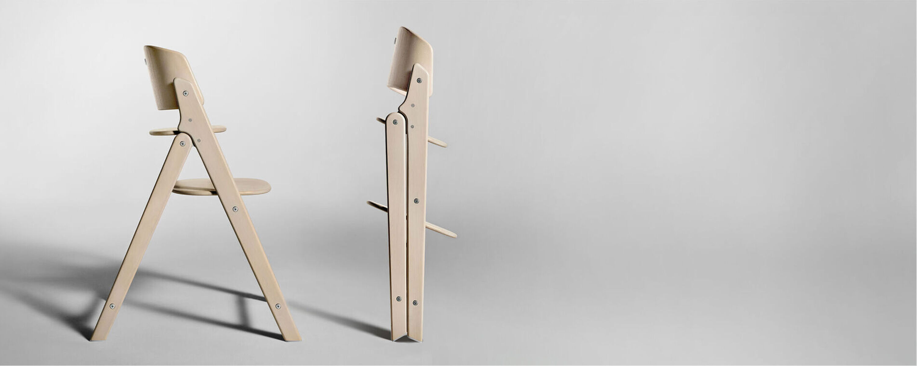 Two Click & Fold Chairs, on the left standing normally, on the right, folded up.