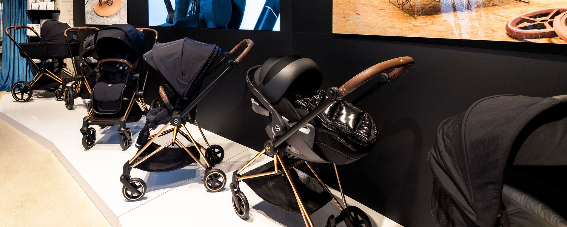 Multiple CYBEX pushchairs on display in black.