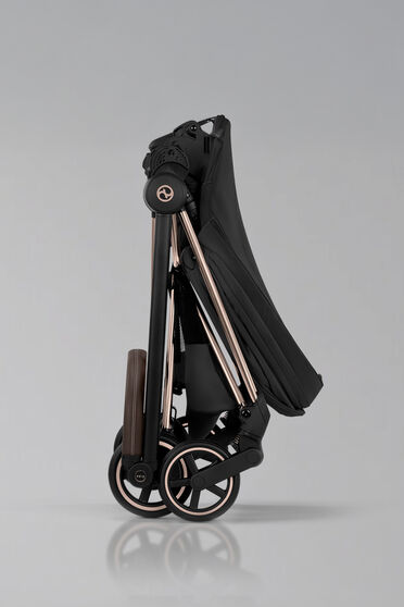 Sideview of a folded up Mios stroller.