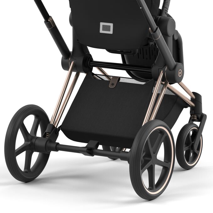 An image of the CYBEX Platinum Priam Jeremy Scott - Car Stroller, highlighting the Extra Large Shopping Basket feature.