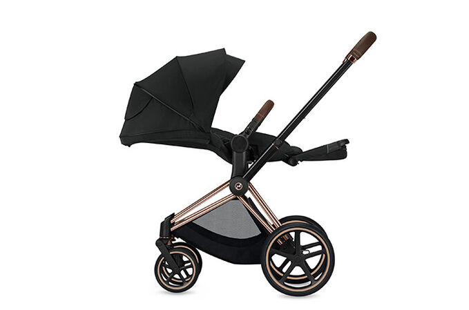 An image of the CYBEX Platinum Priam 3 Frame Stroller, highlighting the Flat, ergonomic lying position feature.