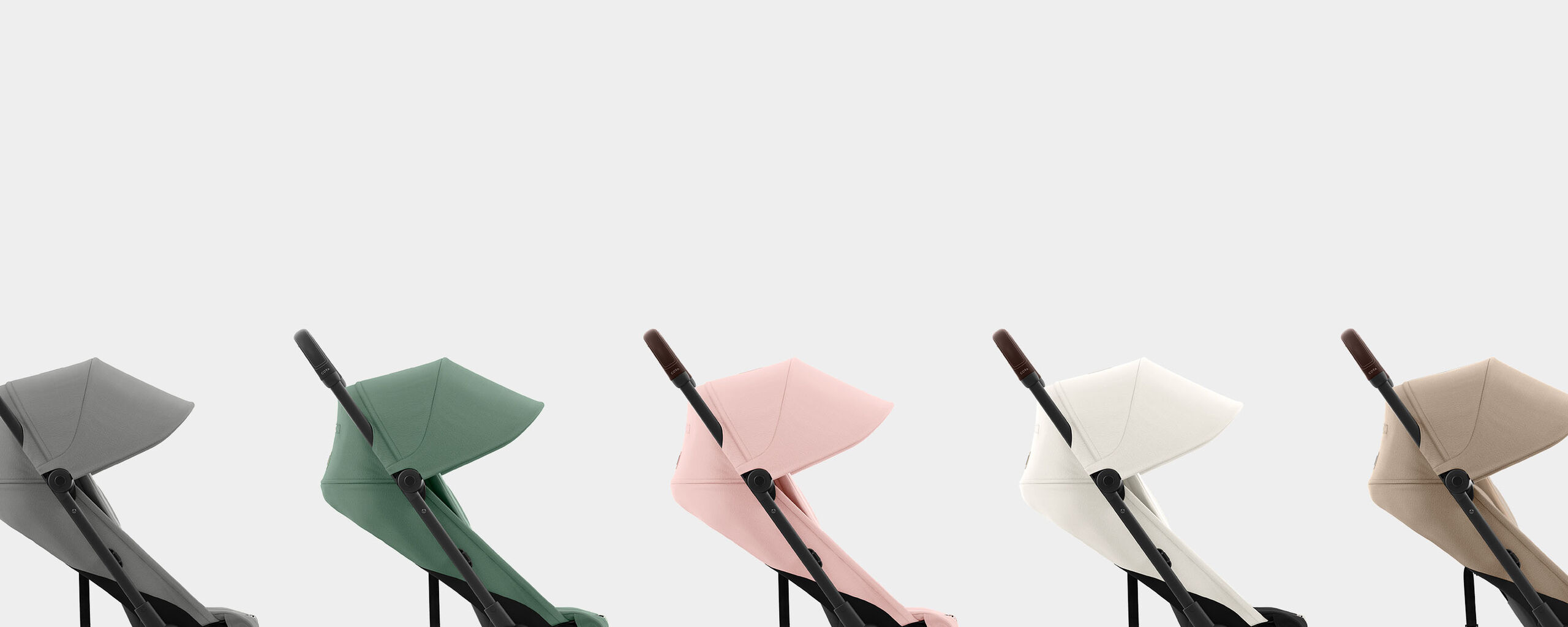 Coya compact travel strollers in various colours side by side