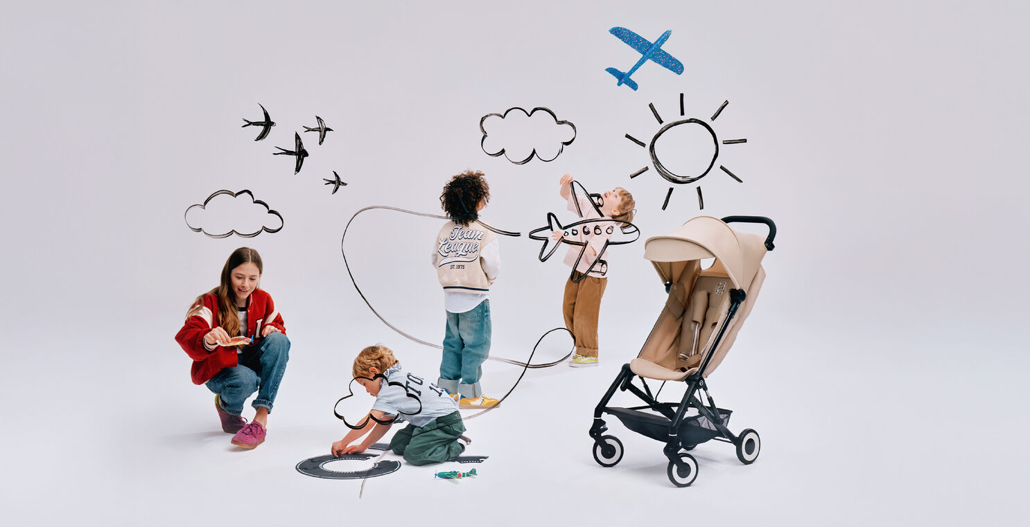 Four children playing, an Agis buggy next to them. 