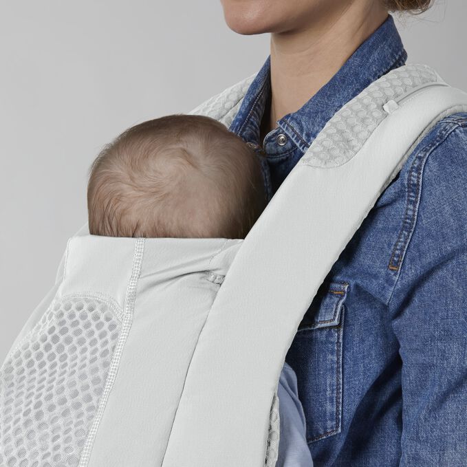 An image of the CYBEX Platinum Coya Carrier Baby Carrier, highlighting the Flexible Neck Support feature.
