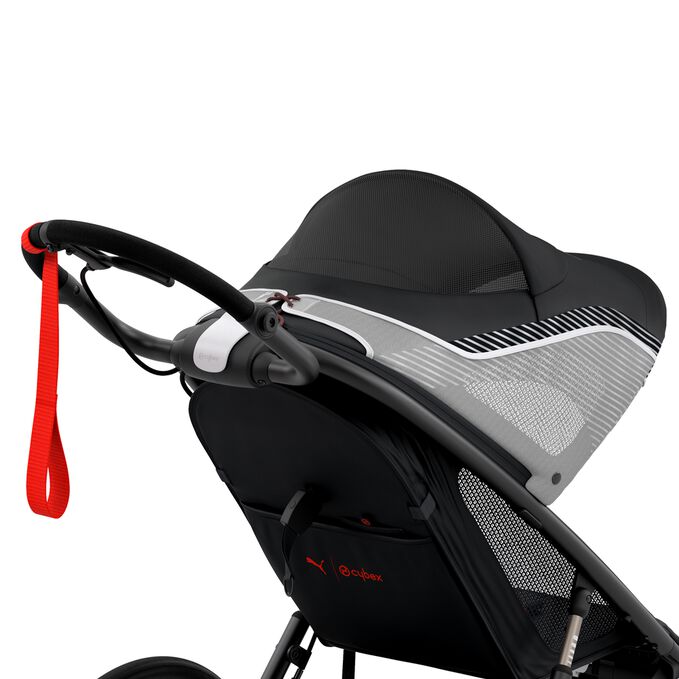 An image of the CYBEX Gold Avi One Box - PUMA Black Jogger, highlighting the XL Sun Canopy with Mesh Window feature.