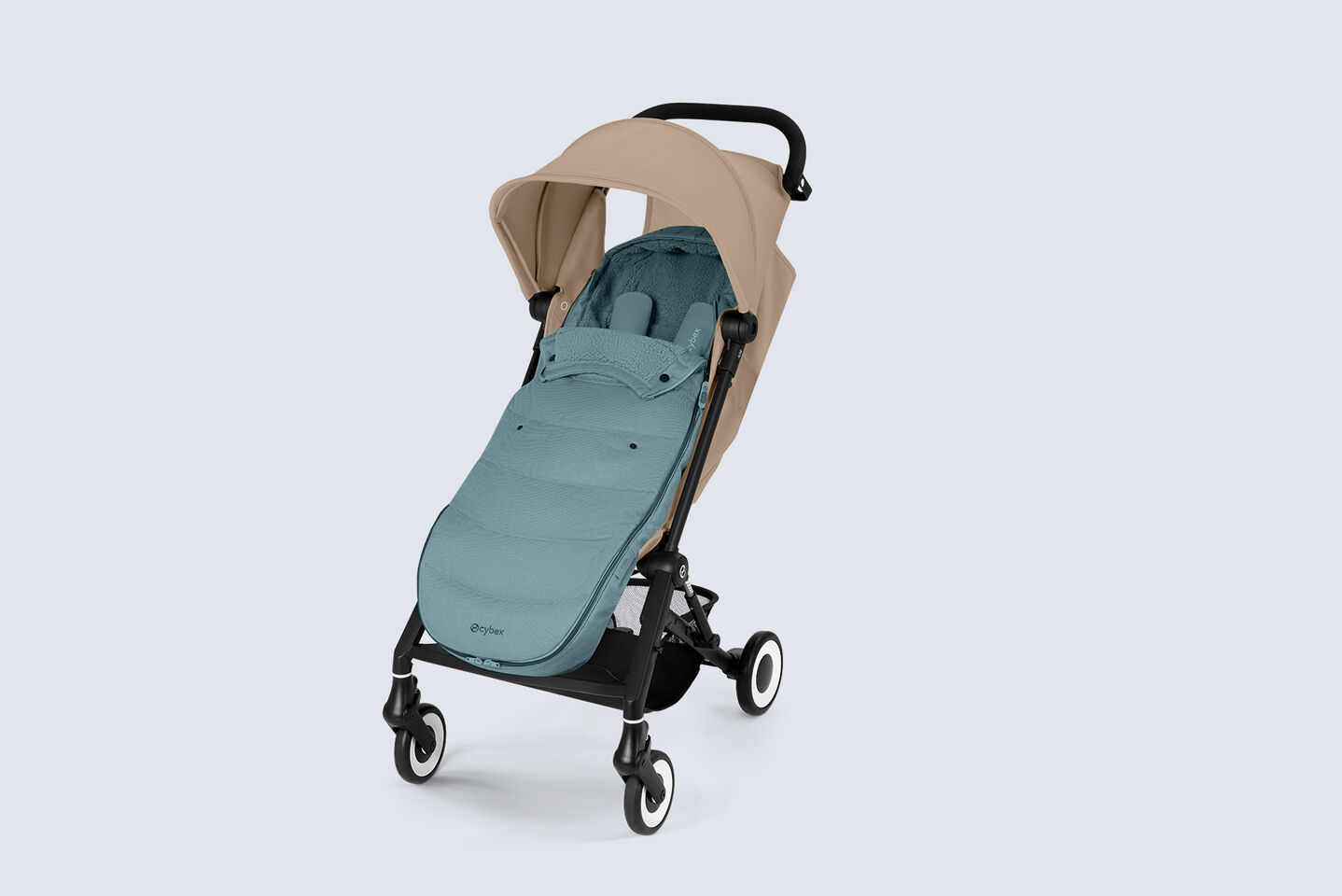 Product shot of an Agis travel buggy with a Gold Footmuff inside