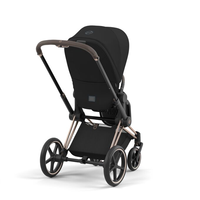 An image of the CYBEX Platinum Priam Jeremy Scott - Wings Stroller, highlighting the Extra large shopping basket feature.