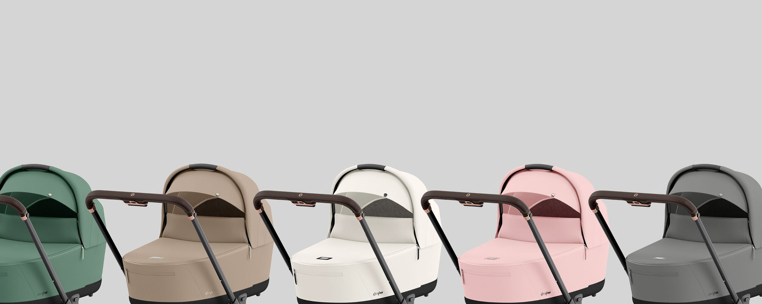 Five e-Priam electric strollers in different colours, from left to right: green, beige, white, pink, and grey.