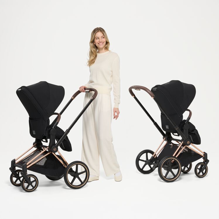 CYBEX Priam 5 reversible seat unit showing parent-facing and forward-facing setup.