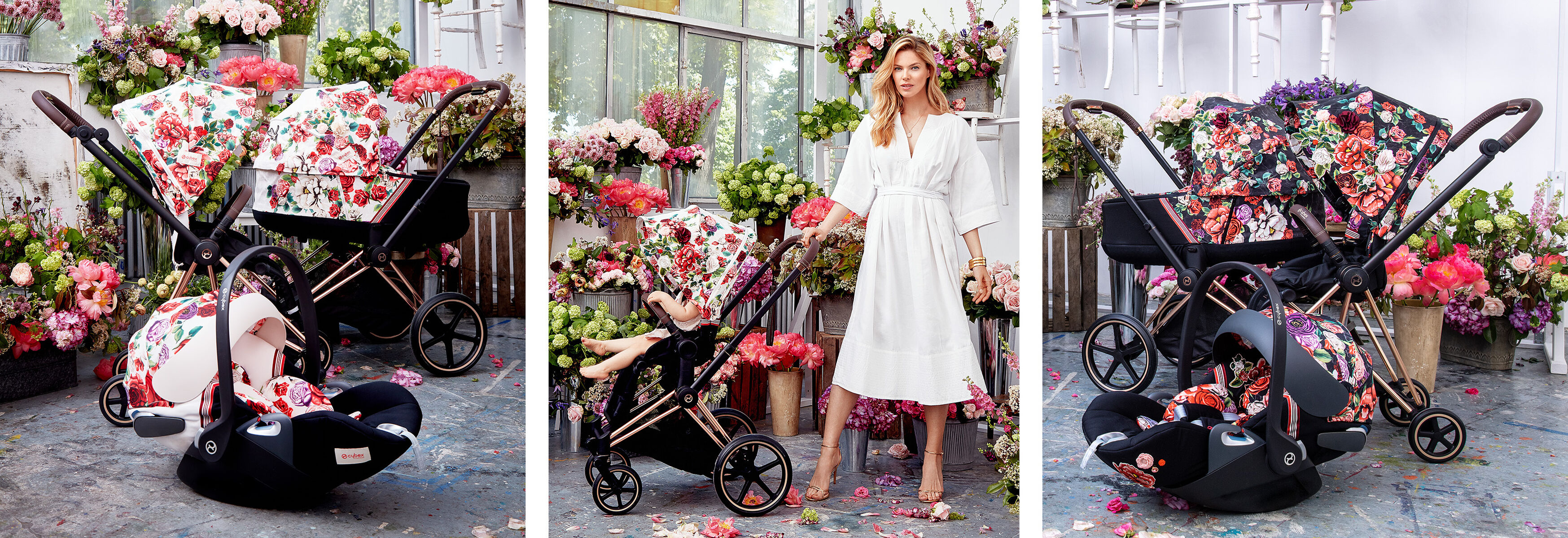 Stroller and car seat with floral pattern surrounded by flower arrangements. A woman in a white dress stands next to them.