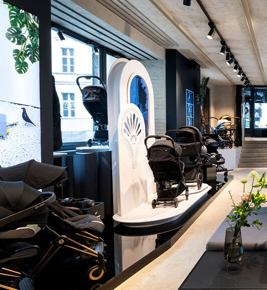 A display with CYBEX pushchairs inside the CYBEX Prague Flagship store.