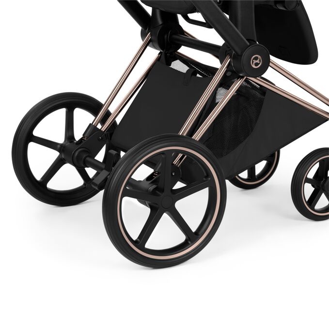 An image of the CYBEX Platinum Priam - Style Collection Stroller Travel Set, highlighting the Extra-large color matching basket feature.