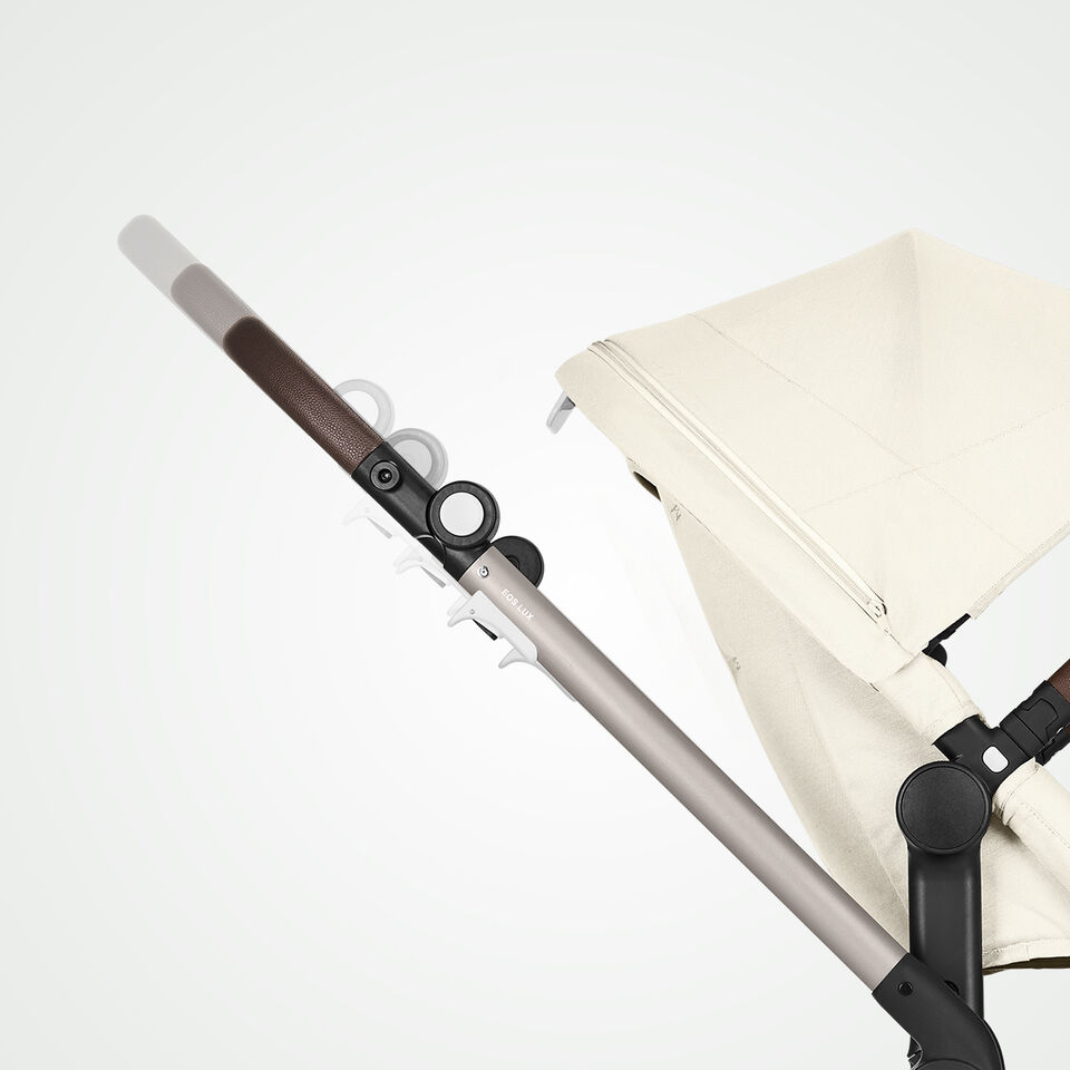 Close up of the adjustable handlebar of a Eos Lux stroller.